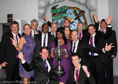 The Hollard Jacana team holding a trophy.