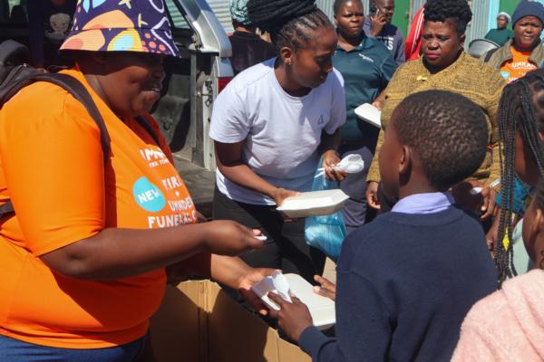 Lumkani, Hollard and local radio station Zibonele FM delivering over 200 hot meals to the fire victims