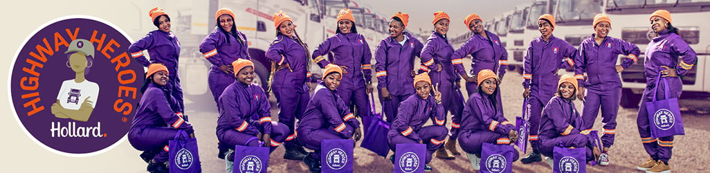 Hollard Highway Heroes Women In Transport group in purple overalls by trucks