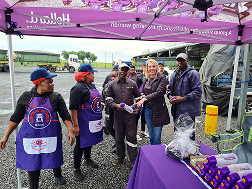 Participants standing under a Hollard-branded gazebo.