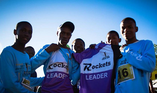 3Mountains participants showing off their branded team jerseys