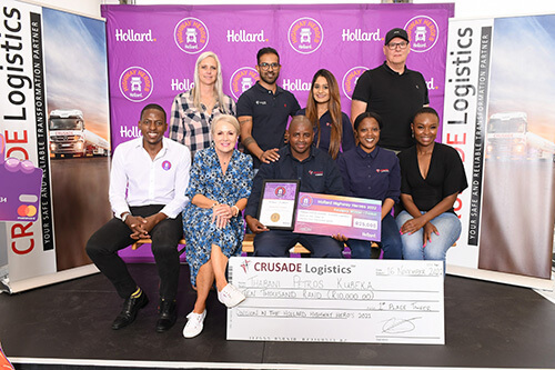 Thabani Kubeka in a group on stage with his award